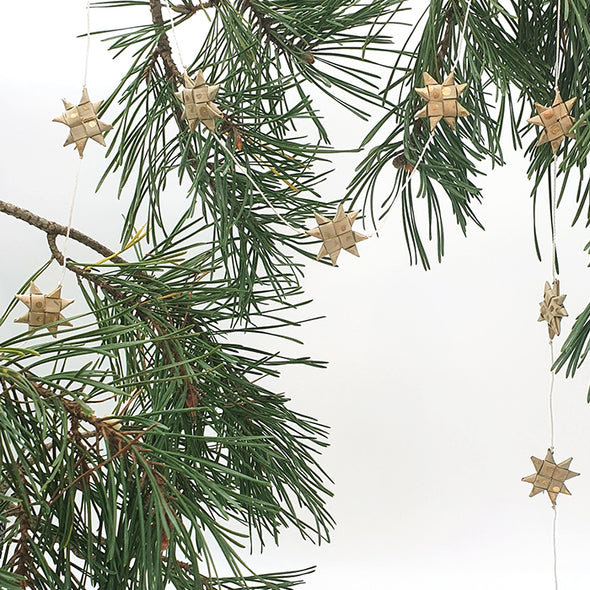 Anna Nera star garland palm tree leaves gold Xmas