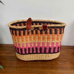 handwoven bike basket fairtrade orange pink black elephant grass