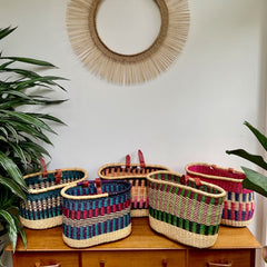 handwoven bike basket fairtrade orange pink black elephant grass