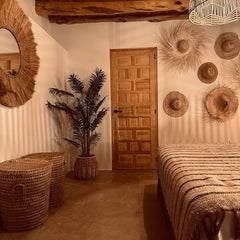 Bohemian Throw in a Boho Ibiza setting Mayala Home + palm hat on the wall