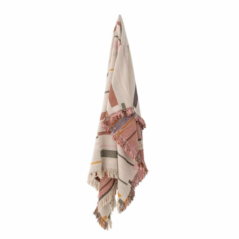 Decorative throw blanket with geometric pattern in pink tones