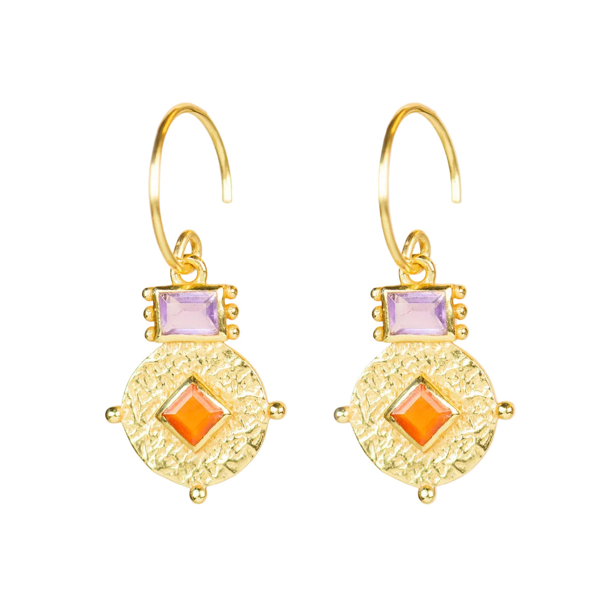 Gold earrings with orange and purple gemstones on a beige background