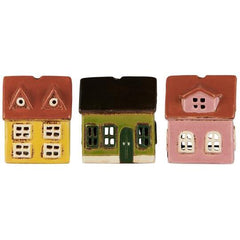 Three small model houses in different colours Ib laursen