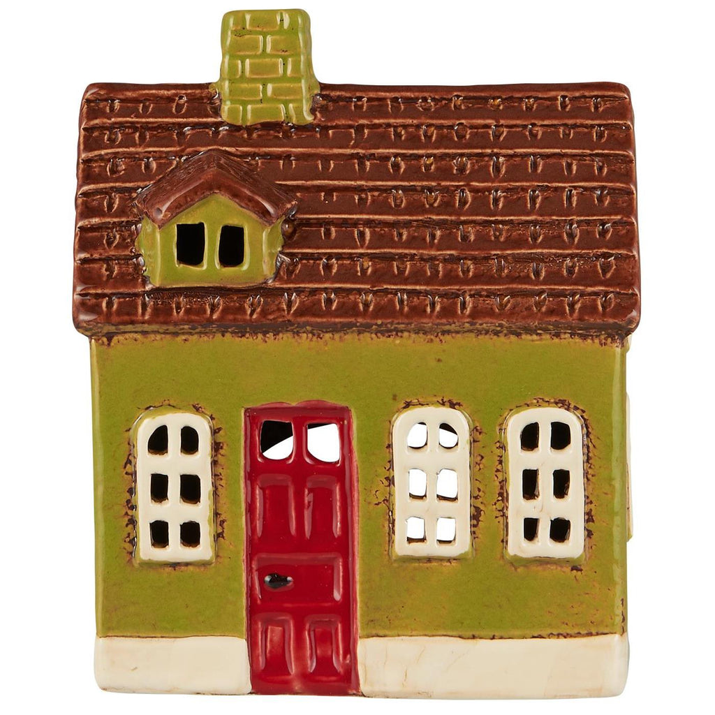 Small ceramic house with a red door, brown roof, and green walls 