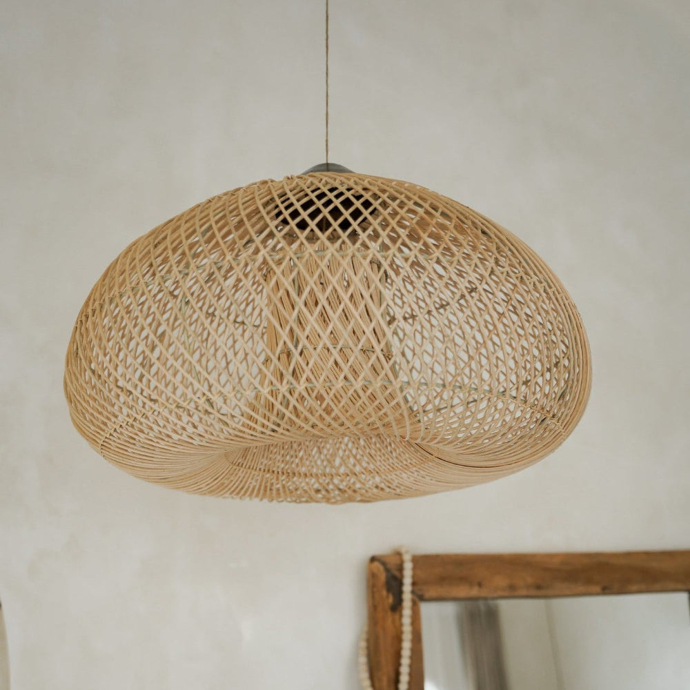 Woven pendant light fixture hanging from ceiling