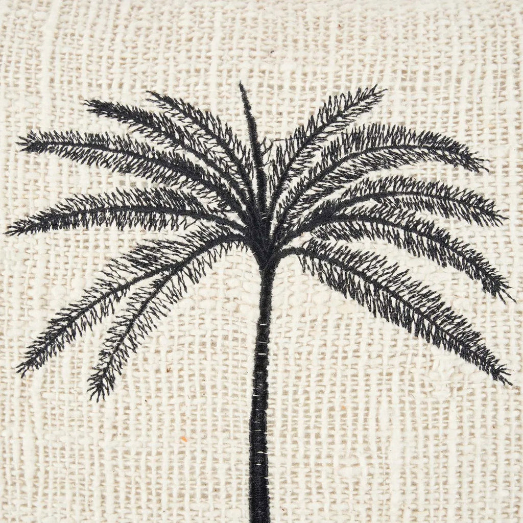 Black palm tree design on a textured beige background