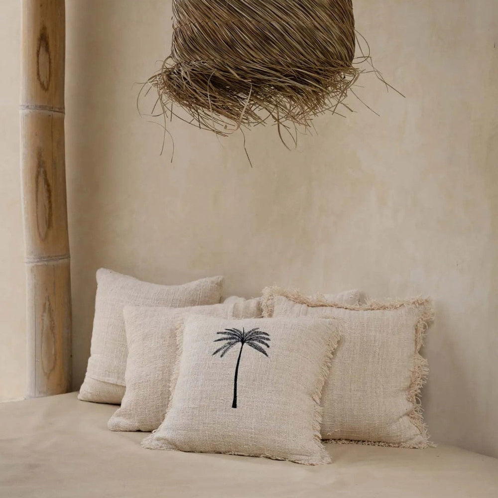 Beige pillows with a palm tree design Bali style