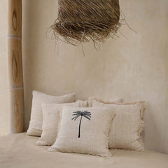 Beige pillows with a palm tree design Bali style