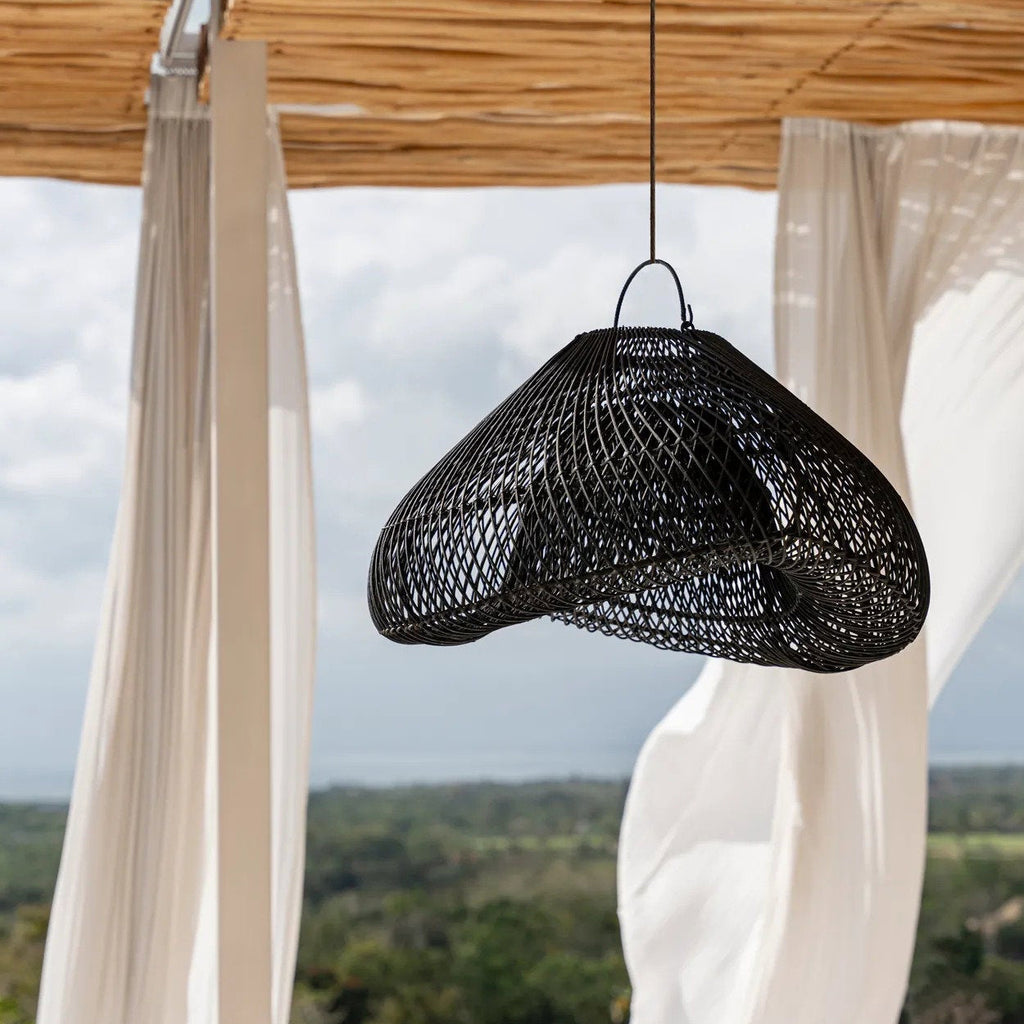 Black woven pendant light hanging covered outdoors