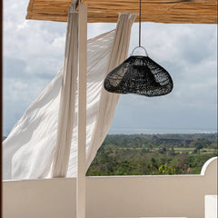 Outdoor patio with black pendant lamp