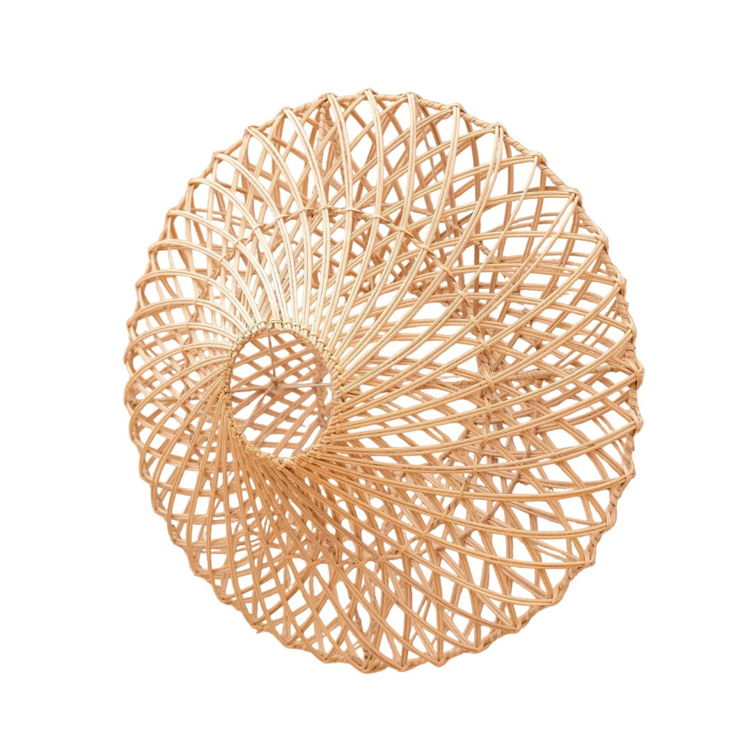 A circular woven rattan wall lamp