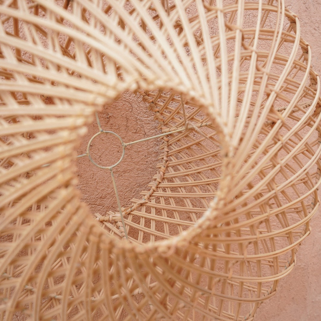 Close-up of a woven natural rattan lampshade