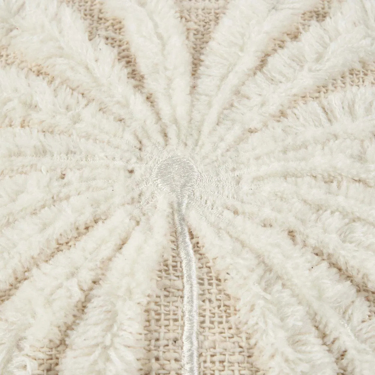 Close-up of textured rattan beige fabric with a fluffy palm tree pattern
