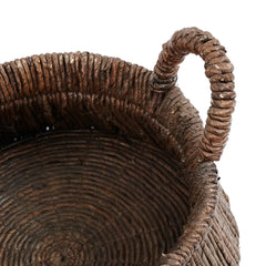 Close-up of a woven basket with a handle