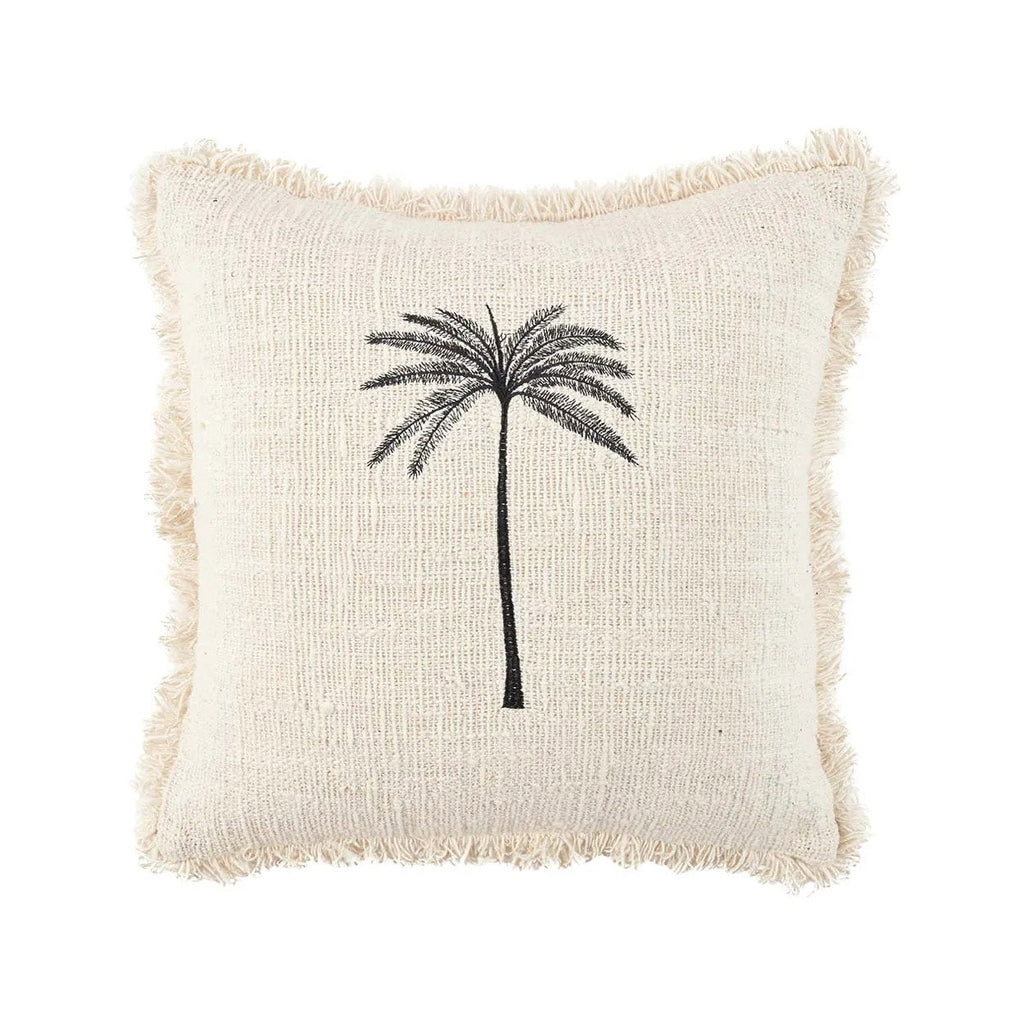 Decorative cushion with a palm tree design on a white background