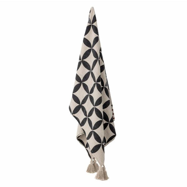 Decorative throw blanket with geometric pattern and tassels on a white background