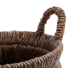 Close-up of a brown woven basket with a handle 