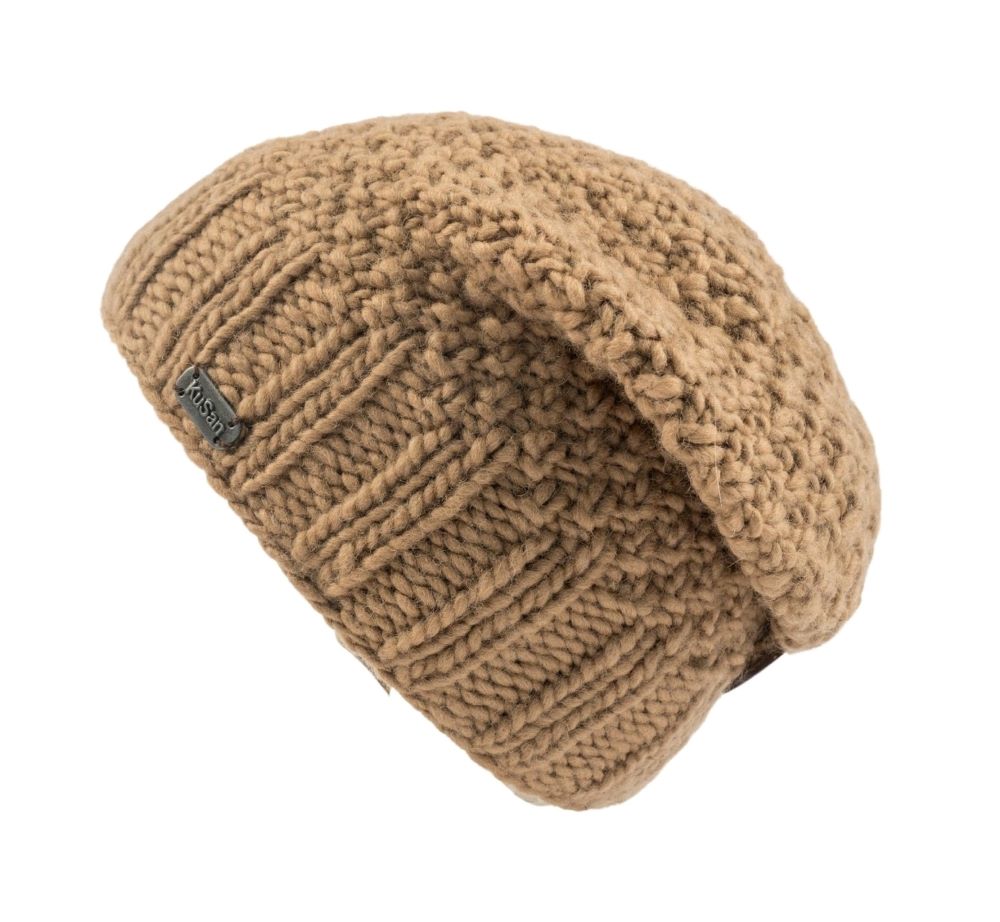 A chunky knit slouchy beanie hat in a warm camel brown color, featuring a small KuSan brand tag on the side