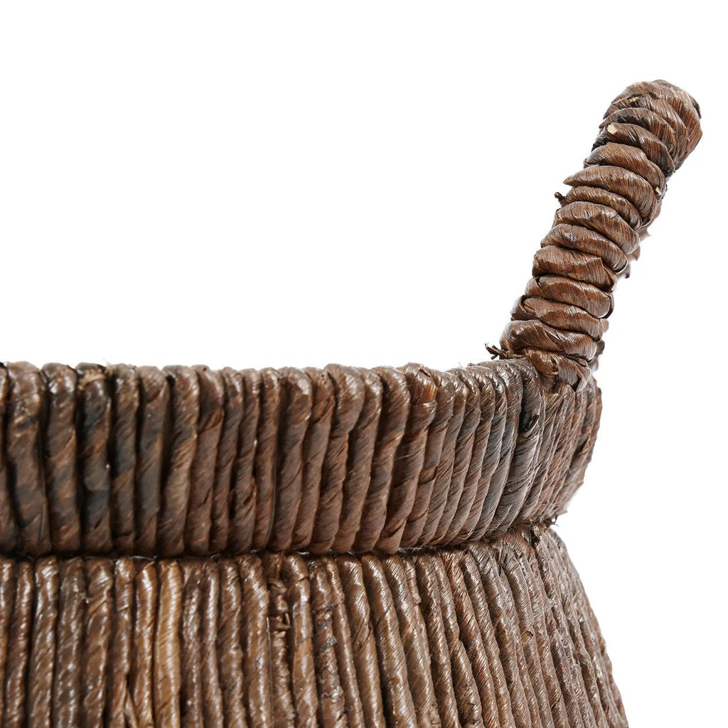 Close-up of a woven basket with a rope handle