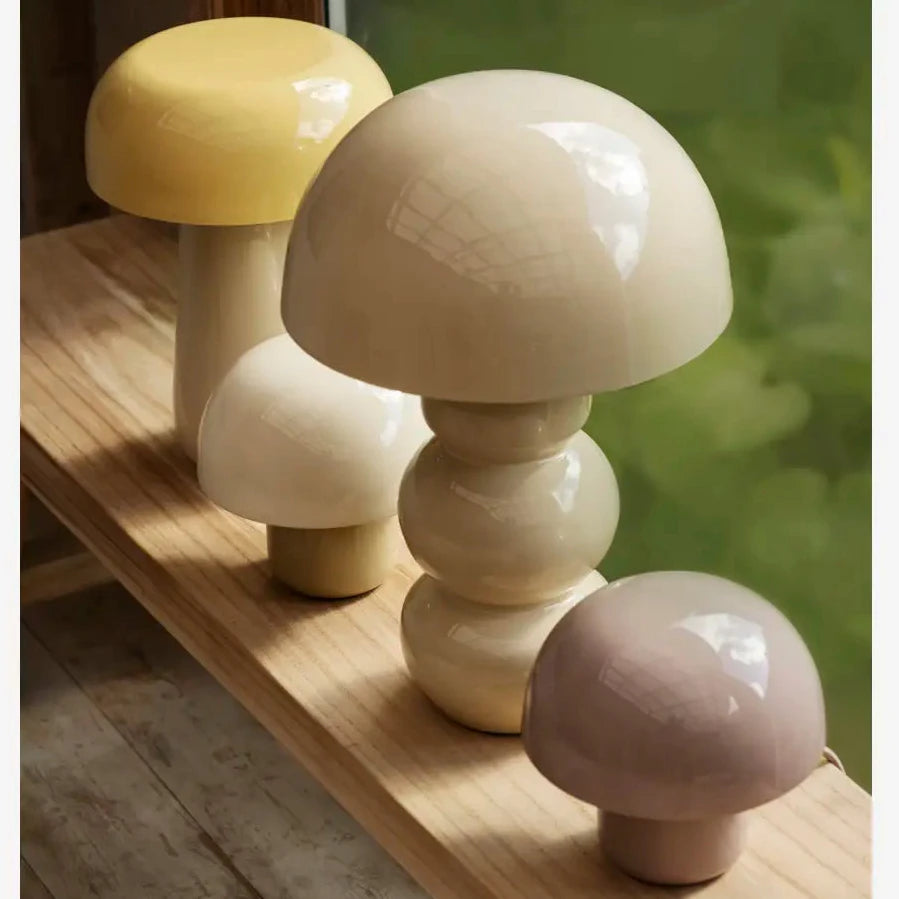 Set of mushroom-shaped lamps on a wooden surface 