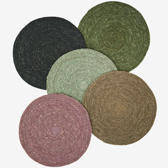 Set of five round woven placemats in various colours