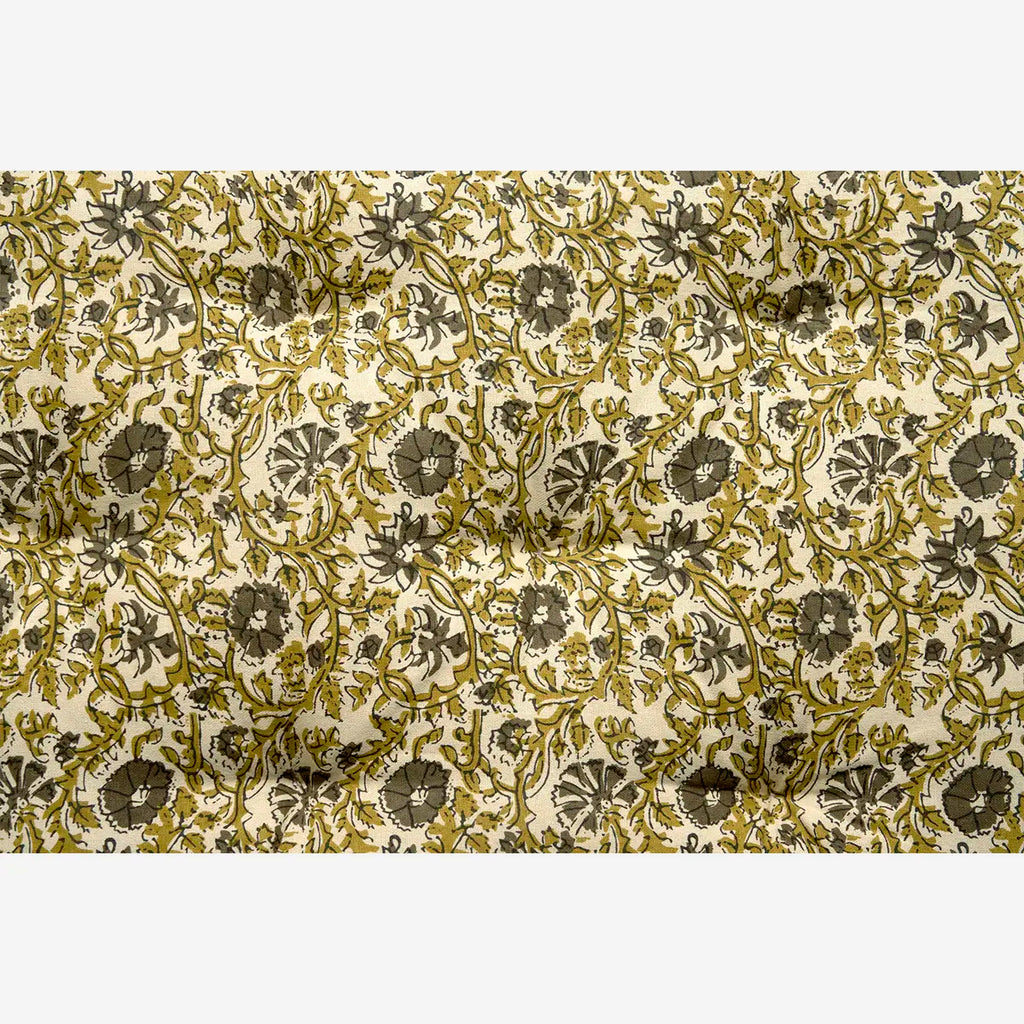 Floral patterned fabric with green and beige mattress