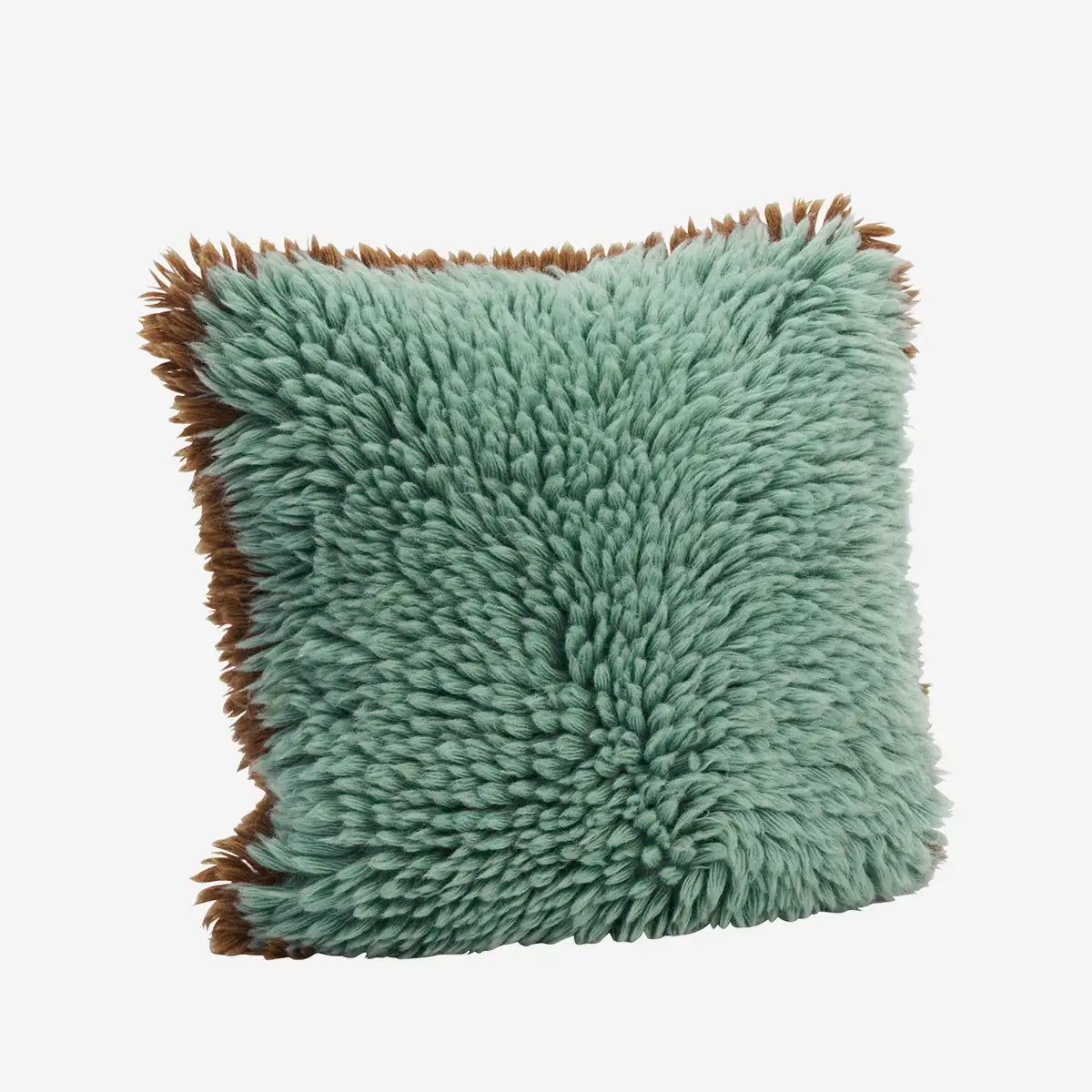 A square shaggy throw pillow in a dusty sage green color with contrasting brown tassel fringe on all sides by Madam Stoltz