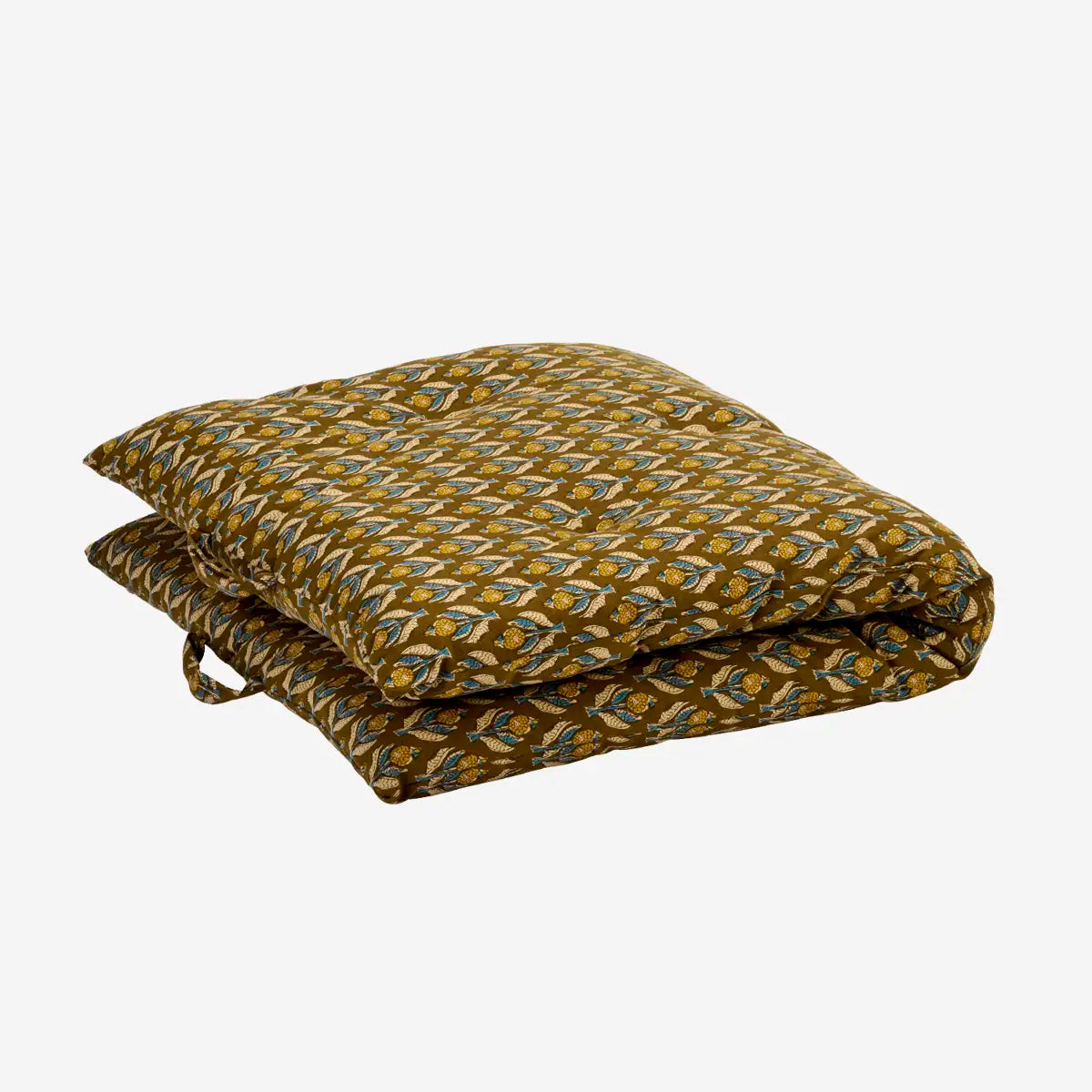 A folded mattress cushion with an allover flower  pattern in olive green, mustard yellow, and light blue.