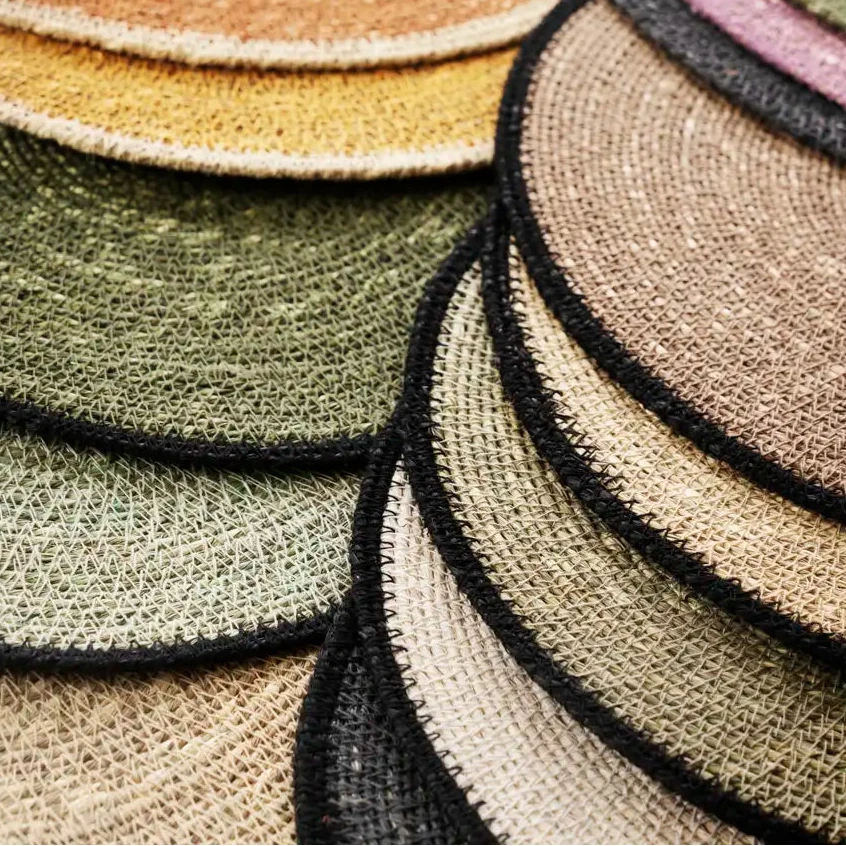 Stack of round woven coasters in various colours