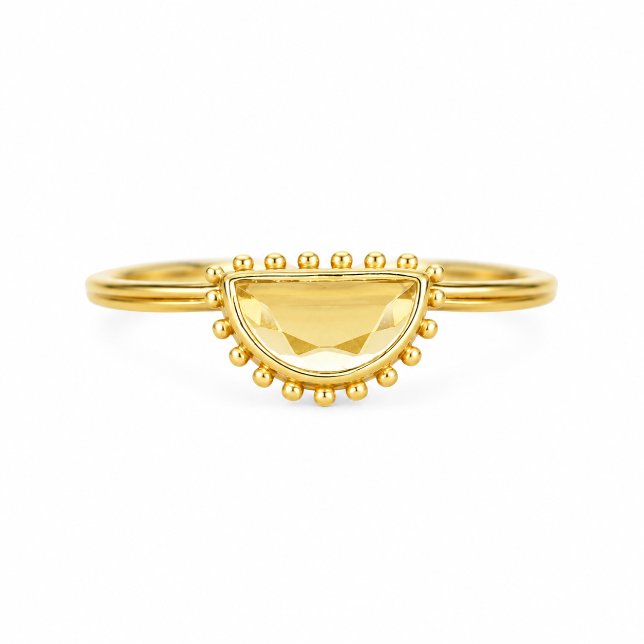 A gold ring featuring a faceted yellow citrine gemstone in a semi-circular bezel setting, surrounded by small gold beads on the band, by Muja Juma.