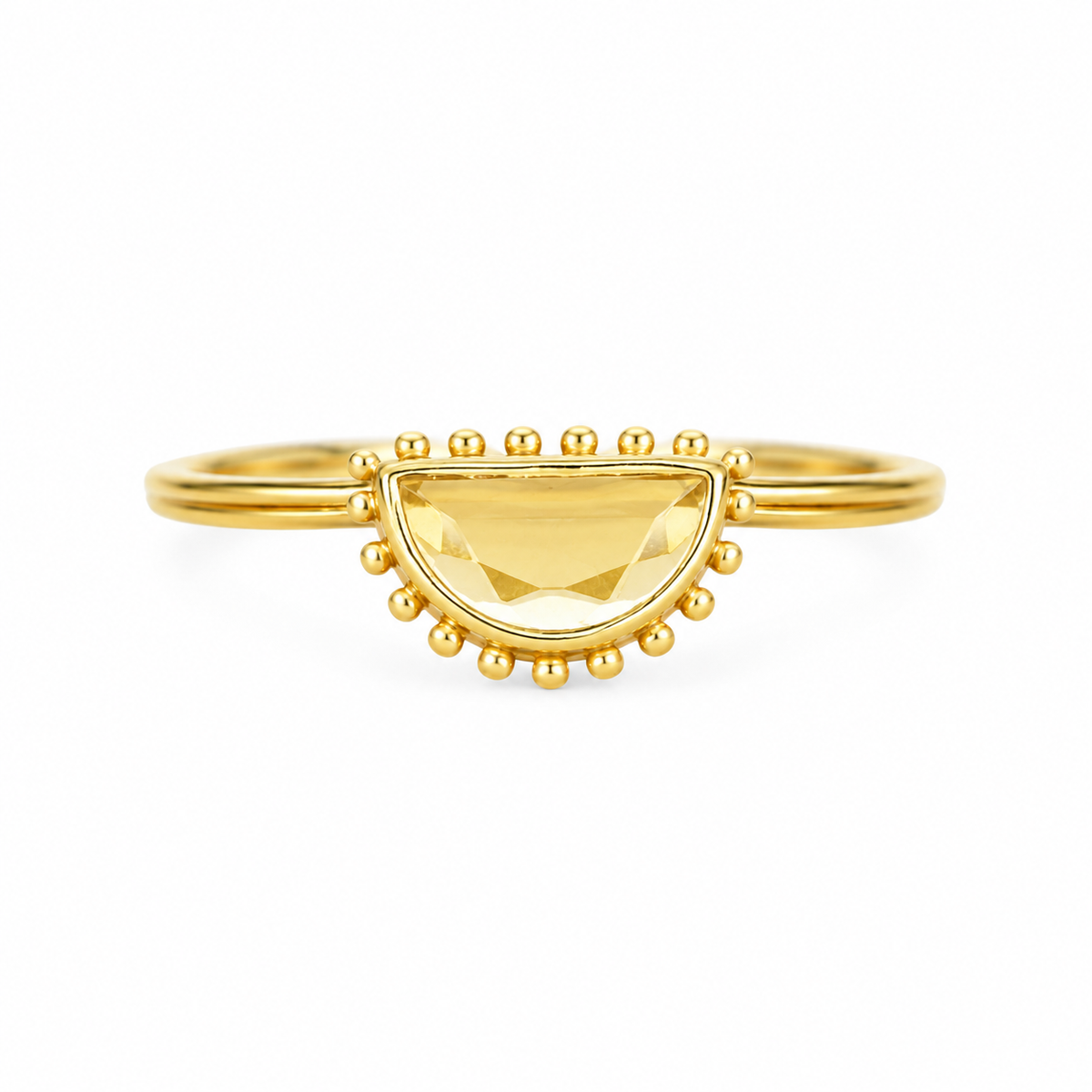 A gold ring featuring a faceted yellow citrine gemstone in a semi-circular bezel setting, surrounded by small gold beads on the band, by Muja Juma.