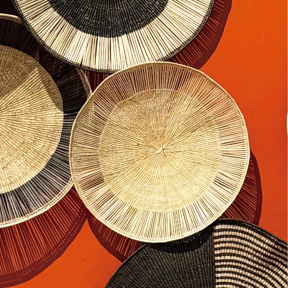 Woven baskets of various colors on a red background