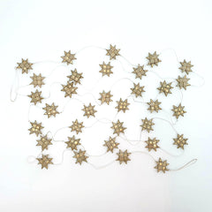 Anna Nera star garland palm tree leaves gold Xmas
