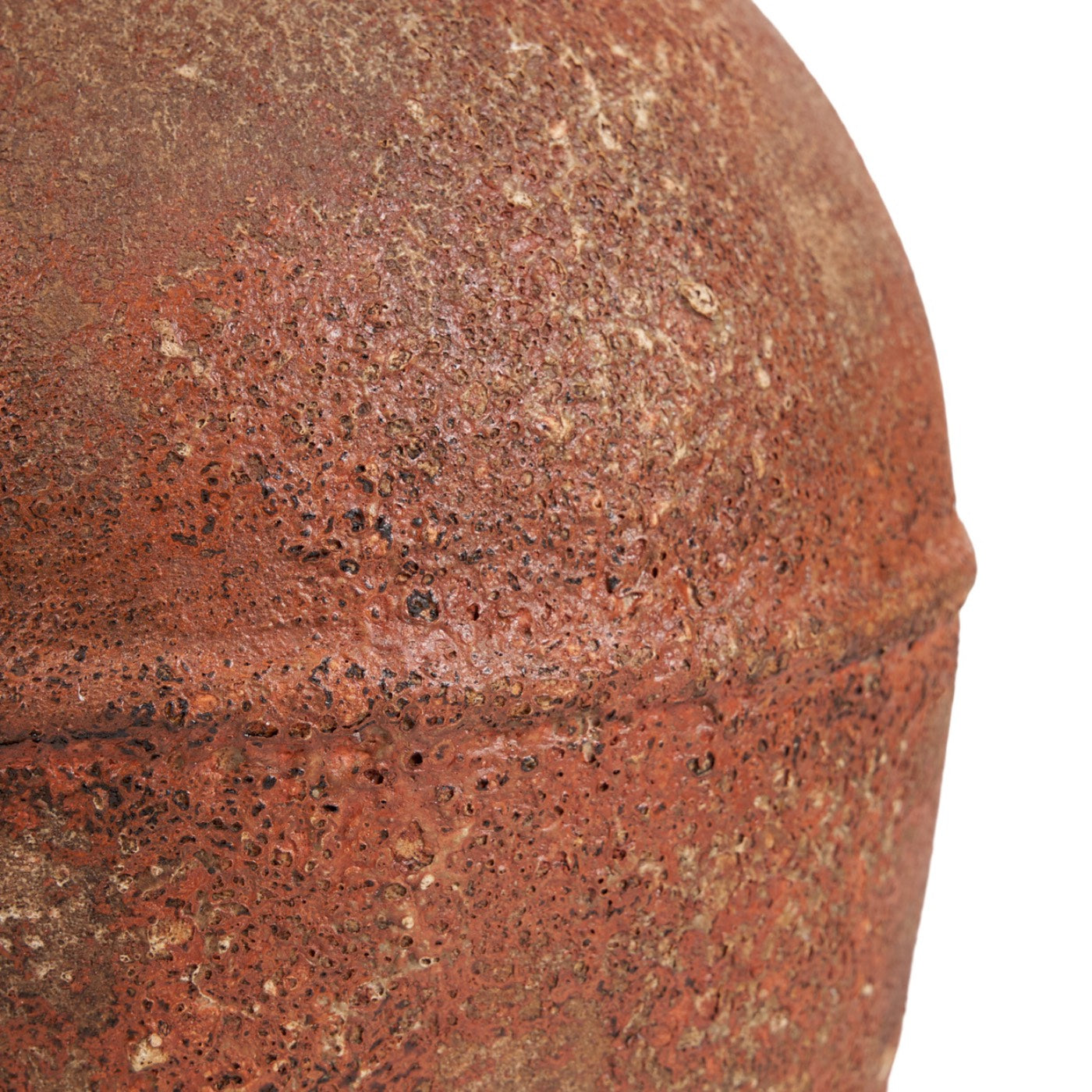 Close-up of a textured brown ceramic pot