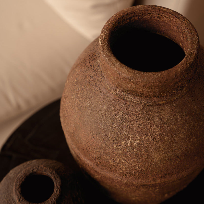 Two rustic clay pots terracotta