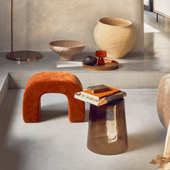 Modern interior with orange velvet stool