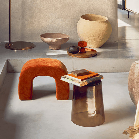 Modern interior with orange velvet stool