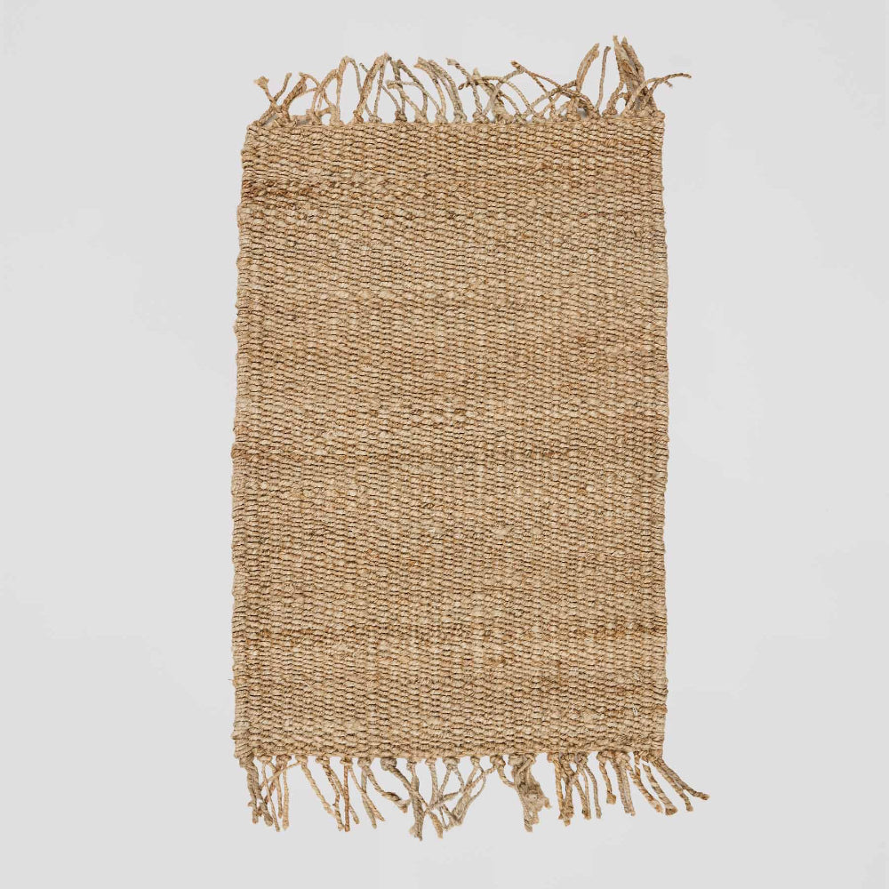 Woven hemp rug with fringes Tell Me More