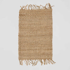 Woven hemp rug with fringes Tell Me More