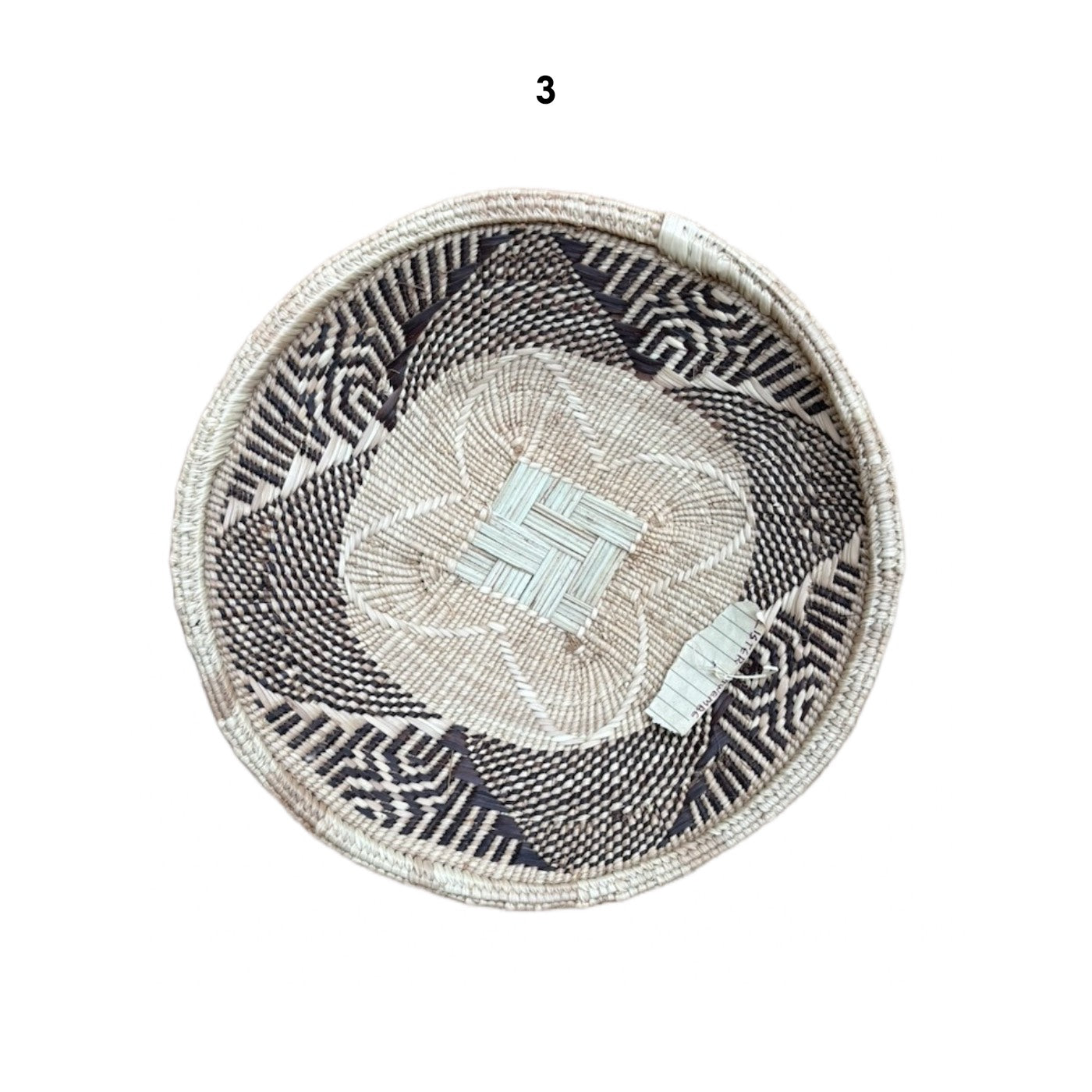 Round woven basket with geometric pattern wall decor