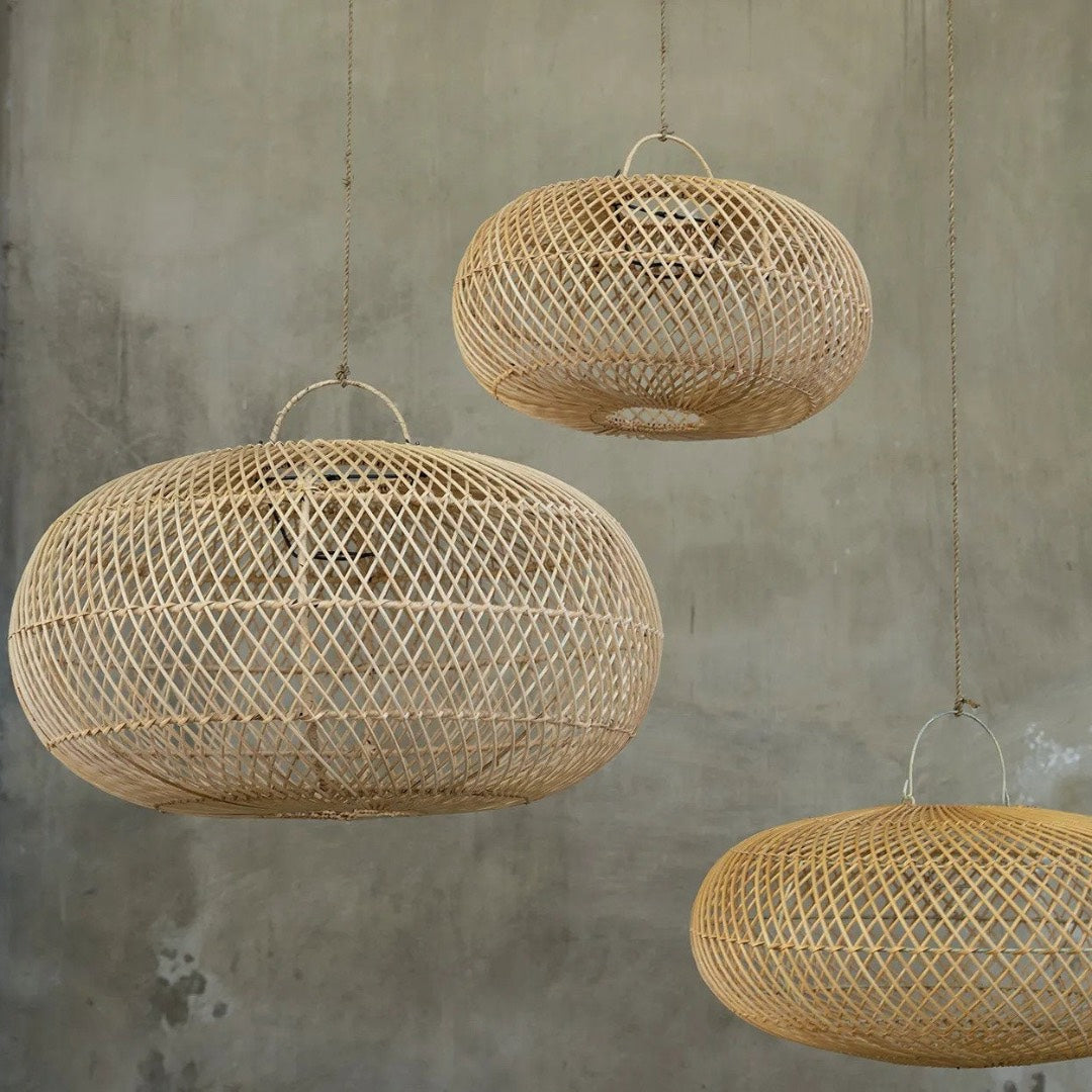 Three woven pendant lights hanging 