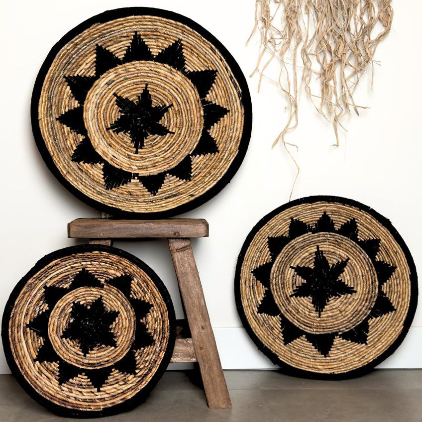 Three woven baskets with black star patterns