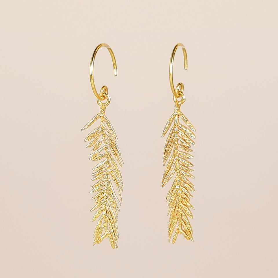 Gold feather-shaped earrings Muja Juma handmade