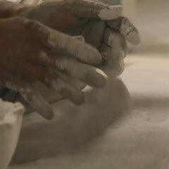 Close-up of hands working with ecomix pottery