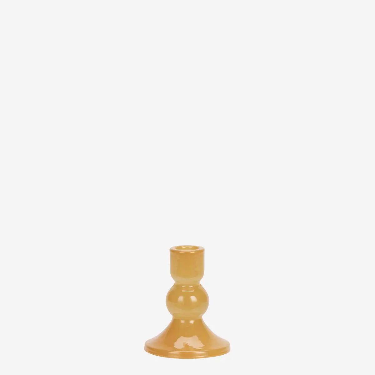 A small glossy amber-yellow candlestick holder with a flared base and a narrow cylindrical top.