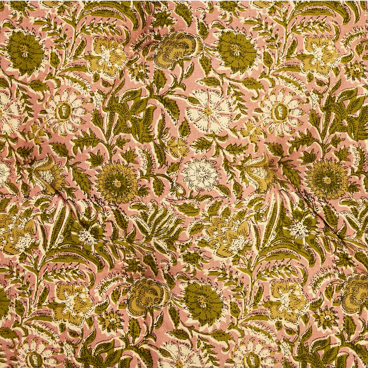 A close-up of a floral fabric pattern featuring olive green, mustard yellow, and cream flowers with green leaves on a dusty pink background.