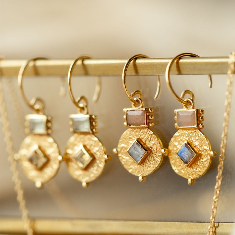 Gold earrings with intricate designs gemstones Muja Juma