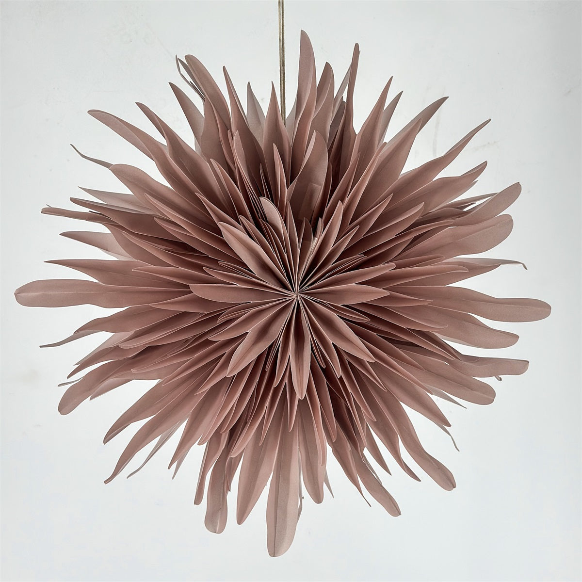 A dusty rose paper lantern decoration hanging 