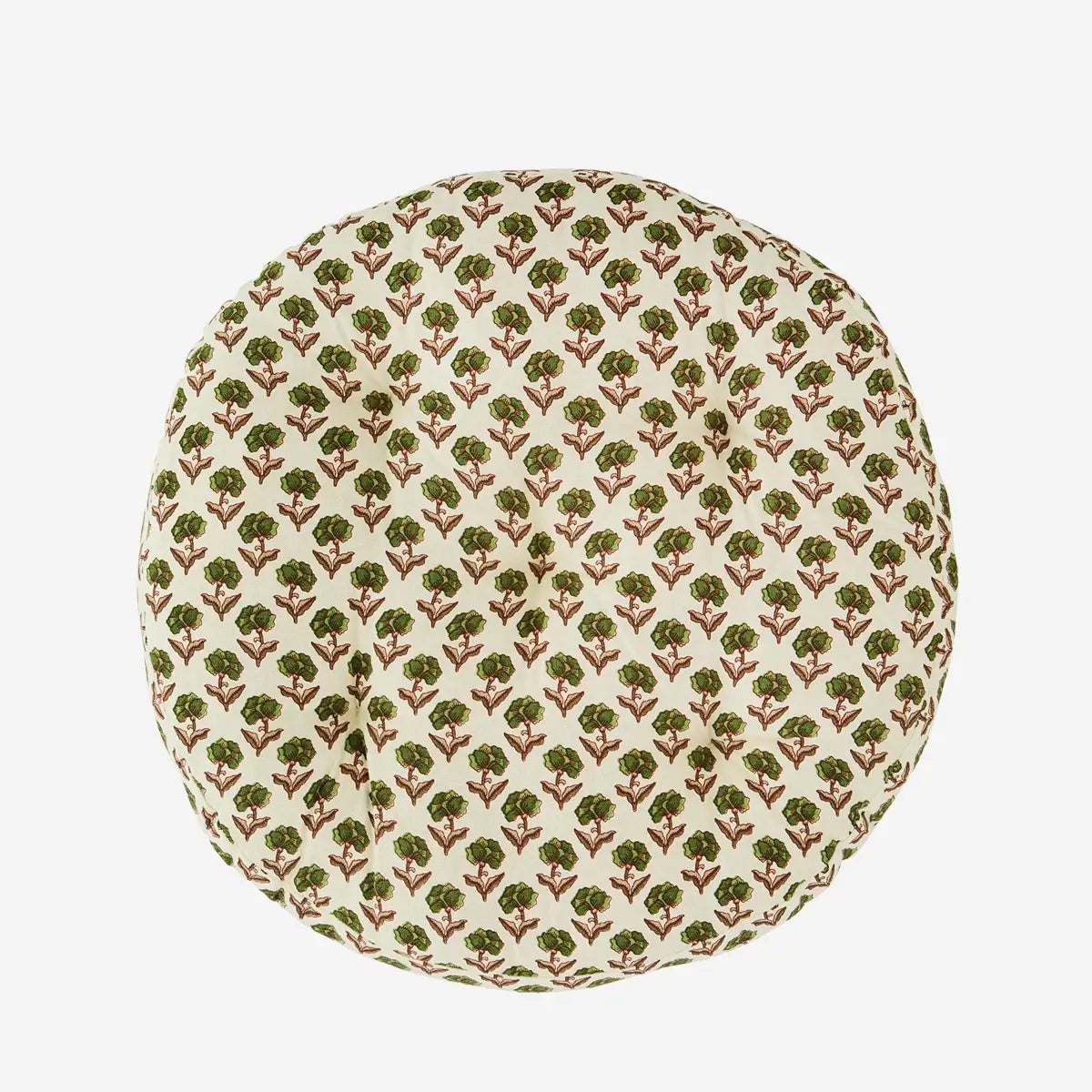 Round cushion with green flower pattern on a beige background