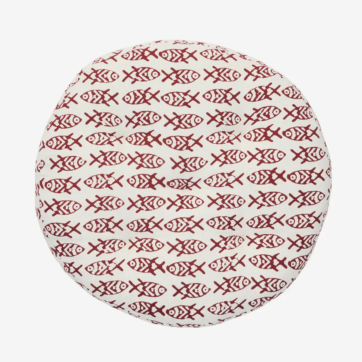 Round cushion with red fish pattern on a white background